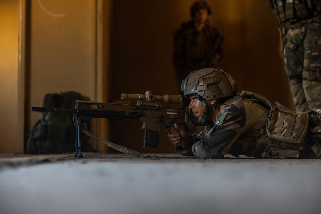 A French Marine with 9th Marine Infantry Brigade, conducts Military Operations on Urbanized Terrain training during Jeanne D’Arc 24 Amphibious Exercise on Camp Lejeune, North Carolina, June 15, 2024. Jeanne D’Arc 24 AMPHIBEX increases 2nd MLG joint interoperability and enhances readiness by employing forces to conduct joint and international training objectives to enhance battlefield relationships. (U.S. Marine Corps photo by Cpl. Alfonso Livrieri)