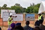 Members of the construction contractor’s team discuss elements of the new National Emergency Operations Center being built in Lomé, Togo during a ceremony celebrating construction starting on the project June 26, 2024. Togolese and U.S. officials joined to celebrate the project, which is funded through the U.S. Africa Command’s Humanitarian Assistance program with the U.S. Army Corps of Engineers managing the construction project. (U.S. Army photo by Chris Gardner)