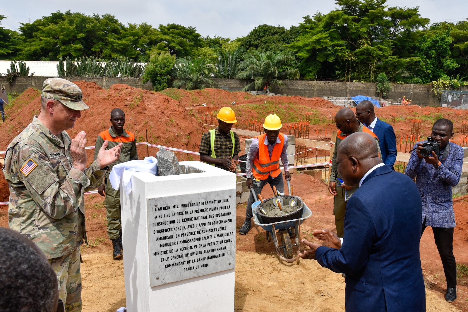 North Dakota National Guard Adjutant General Maj. Gen. Alan Dorhmann and Republic of Togo Minister of Security and Civil Protection Calixte Batossie Madjoulba unveil a monument during a ceremony celebrating construction starting on the new National Emergency Operations Center being built in Lomé, Togo June 26, 2024. Togolese and U.S. officials joined to celebrate the project, which is funded through the U.S. Africa Command’s Humanitarian Assistance program with the U.S. Army Corps of Engineers managing the construction project. (U.S. Army photo by Chris Gardner)