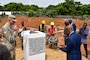 North Dakota National Guard Adjutant General Maj. Gen. Alan Dorhmann and Republic of Togo Minister of Security and Civil Protection Calixte Batossie Madjoulba unveil a monument during a ceremony celebrating construction starting on the new National Emergency Operations Center being built in Lomé, Togo June 26, 2024. Togolese and U.S. officials joined to celebrate the project, which is funded through the U.S. Africa Command’s Humanitarian Assistance program with the U.S. Army Corps of Engineers managing the construction project. (U.S. Army photo by Chris Gardner)