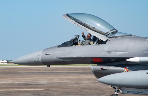 Brig. Gen. Jeffrey Geraghty, 96th Test Wing commander, waves to his family and Wing members during his fini flight at Eglin Air Force Base, Fla., July 1, 2024.