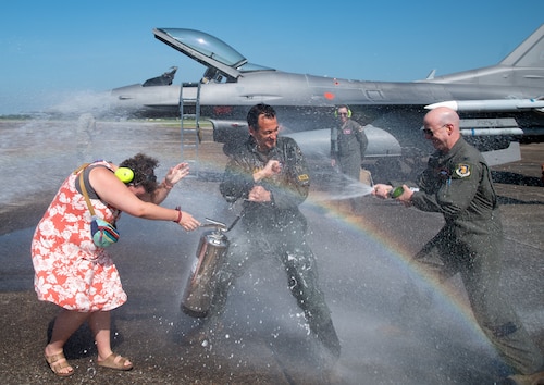 Brig. Gen. Jeffrey Geraghty, 96th Test Wing commander, gets soaked by Wing members, during his fini flight at Eglin Air Force Base, Fla., July 1, 2024.