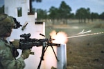 Combat medics use M249 light machine gun during field observational assessment