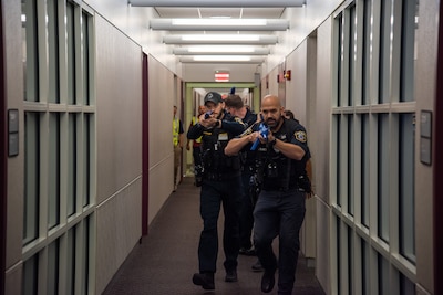 Police with firearms in a building
