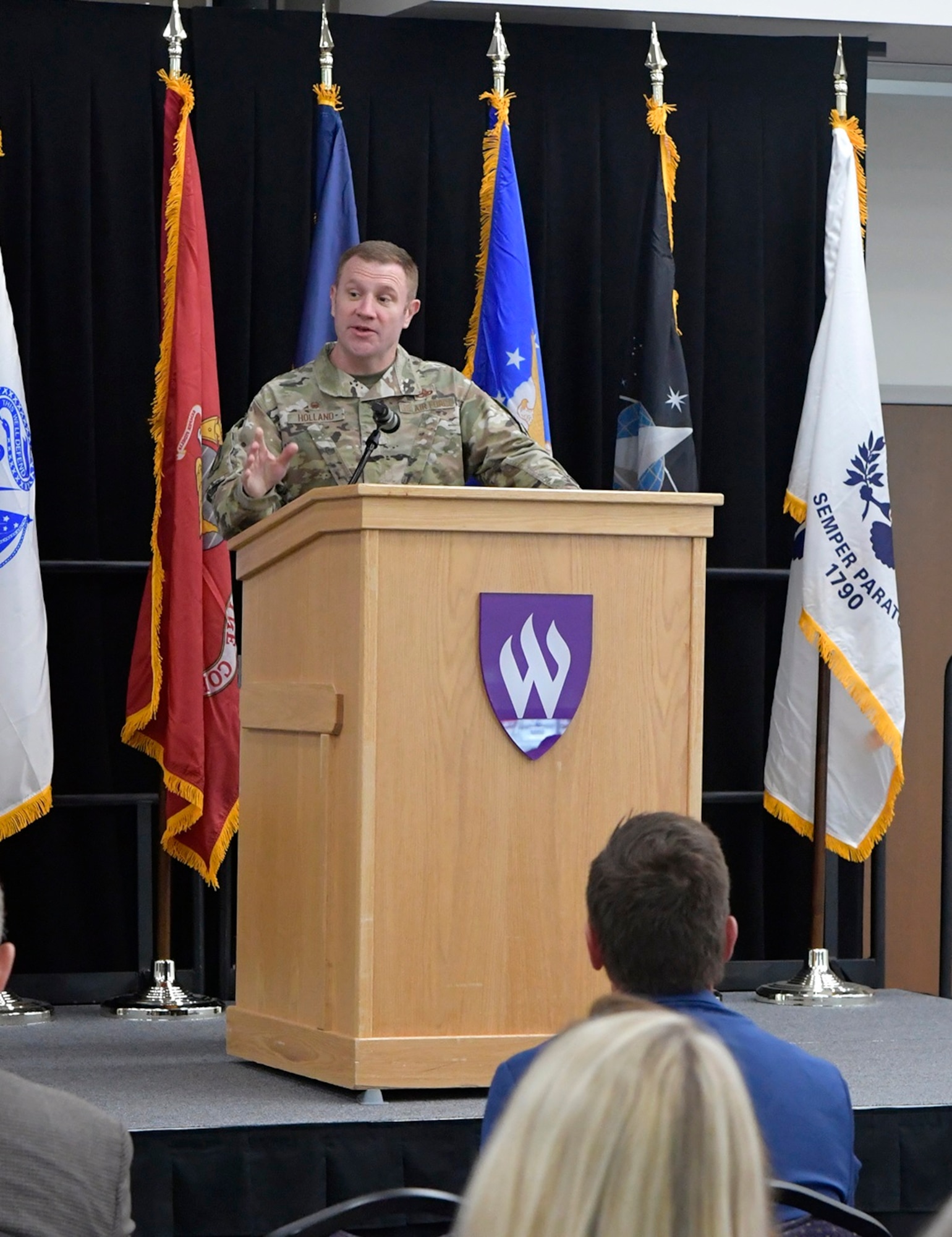 Col. Jeffrey Holland, 75th Air Base Wing commander, speaks at a ceremony where a new partnership partnership agreement was formed between Hill Air Force Base and Weber State University.  The agreement expands education opportunities for military personnel, their families and civilian employees by offering master’s degree programs on the base. (US Air Force photo by Todd Cromar)