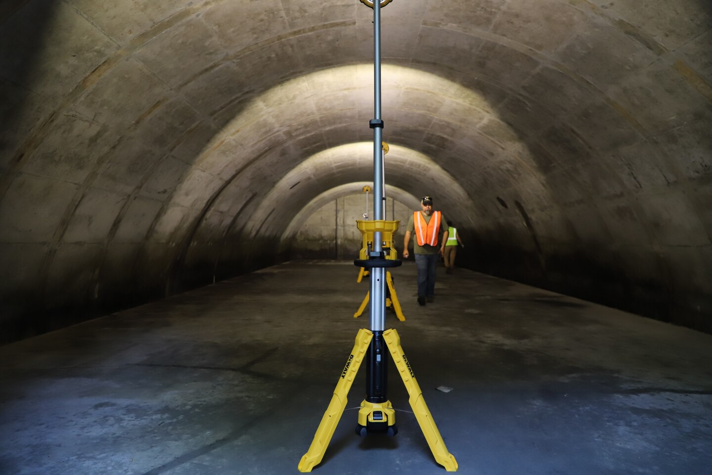 The ERDC-CERL team setting up lighting inside the Earth Covered Magazines (ECMs)