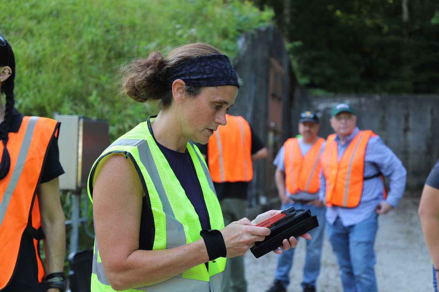 ERDC-CERL's Rebekah Wilson taking notes on conditions within the Earth Covered Magazines (ECMs)