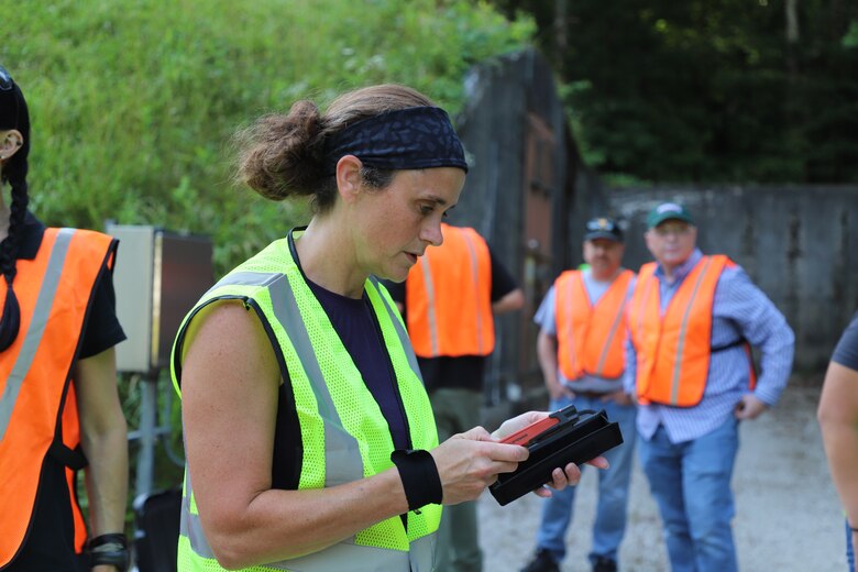 ERDC-CERL's Rebekah Wilson taking notes on conditions within the Earth Covered Magazines (ECMs)