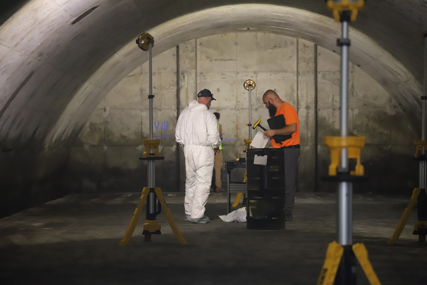 The ERDC-CERL team studying field samples of mold within the Earth Covered Magazines (ECMs)
