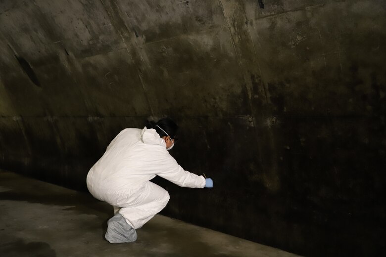 The ERDC-CERL team studying field samples from the Earth Covered Magazines (ECMs)