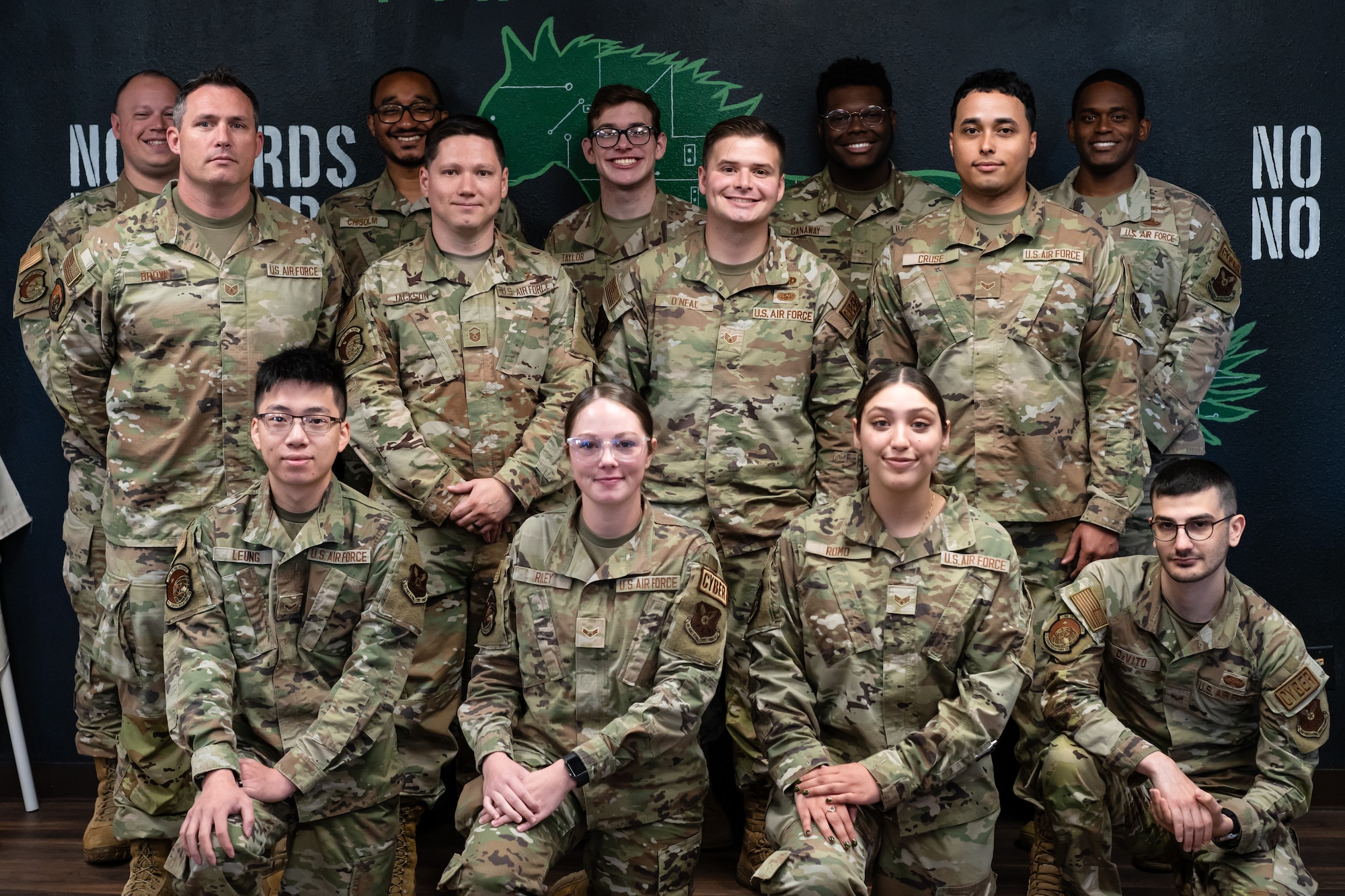U.S. Air Force Airmen with the 7th Communications Squadron infrastructure section pose for a team photo at Dyess Air Force Base, Texas, June 26, 2024. The team was recognized for their completion of a base-wide network improvement, spanning over nine months. The team overcame the challenge of the manpower and workload involved with maintaining normal base operations while simultaneously replacing and improving network hardware. (U.S. Air Force photo by Airman 1st Class Jade M. Caldwell)