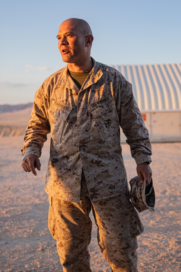 U.S. Marine Corps Col. Robert M. Barnhart Jr., commanding officer, 23rd Marine Regiment, 4th Marine Division, Marine Forces Reserve, congratulates U.S. Marines with Truck Company, 23rd Marine Regiment, 4th Marine Division, Marine Forces Reserve, on being awarded the 2023 Marine Corps Motor Transport Unit of the Year during Integrated Training Exercise 4-24 at Marine Air-Ground Combat Center, Twentynine Palms, California, June 26, 2024. Units awarded are evaluated based on mission accomplishment, impact and innovation actions, employment of logistics principles and resources, and unit quality of life program. (U.S. Marine Corps photo by Lance Cpl. Orion Stpierre)