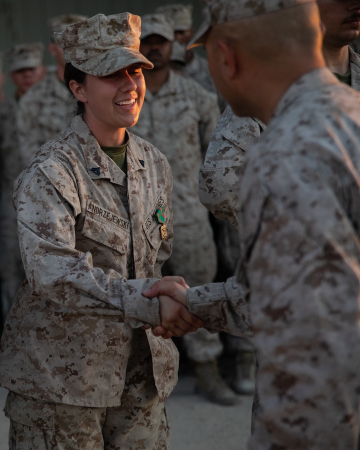U.S. Marine Corps Cpl. Hunter M. Andrzejewski, Pennsylvania native, team leader, 25th Marine Regiment, 4th Marine Division, Marine Forces Reserve, receives a Navy and Marine Corps Achievement Medal during Integrated Training Exercise 4-24 at Marine Air-Ground Combat Center Twentynine Palms, California, June 26, 2024. The NAM is awarded to U.S. service members that demonstrate superior performance and sustained meritorious service in their duties. ITX enables the Reserve Component to simulate a mobilization and deploy its forces in preparation for potential future deployments in the event of a contingency or crisis. (U.S. Marine Corps photo by Lance Cpl. Orion Stpierre)