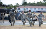 U.S. Army Soldiers assigned to Tripler Army Medical Center simulate transporting patients to the TAMC Emergency Department as part of a mass casualty exercise on Aug. 10, 2023