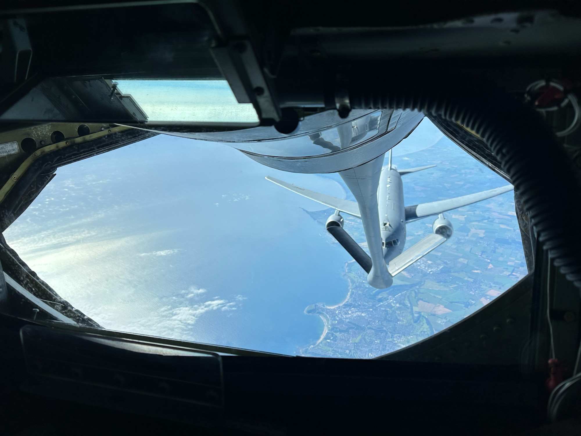 A 350th Air Refueling Squadron KC-135R Stratotanker from McConnell Air Force Base, Kansas, refuels a McConnell KC-46A Pegasus over the United Kingdom, July 1, 2024. The KC-46 was taking part in a 45-hour Maximum Endurance Operation, called Project Magellan, launching June 29 from McConnell Air Force Base, flying westward, non-stop, around the world and landing back at McConnell July 1.  (U.S. Air Force photo by Airman 1st Class Gavin Hameed)
