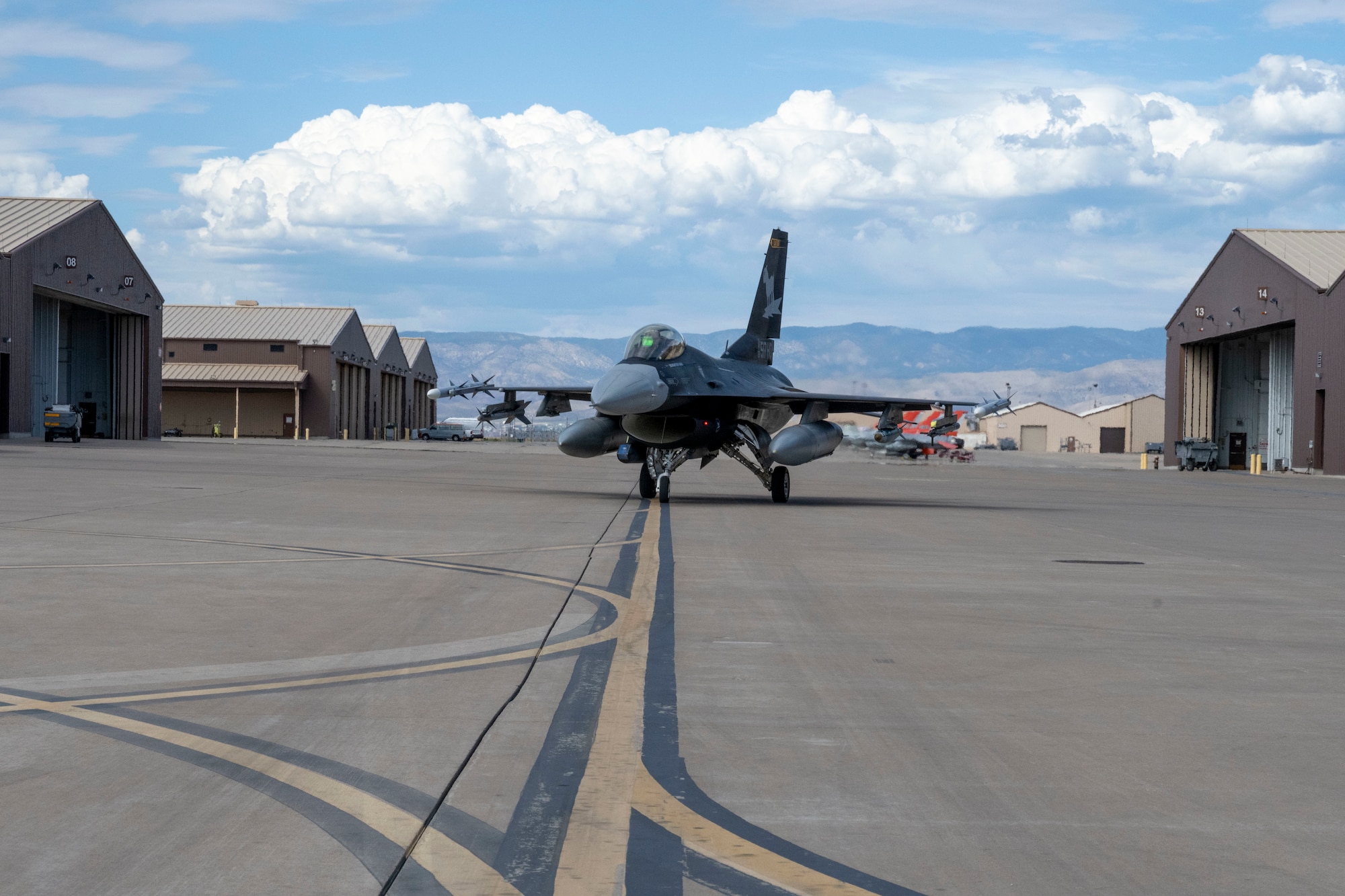An F-16 Viper assigned to the 8th Fighter Squadron taxis out for a training sortie at Holloman Air Force Base, New Mexico, June 28, 2024. The 8th Fighter Squadron unveiled its new flagship, painted with a matte black color scheme that draws inspiration from the legendary F-117 Nighthawk stealth aircraft. (U.S. Air Force photo by Airman 1st Class Michelle Ferrari)