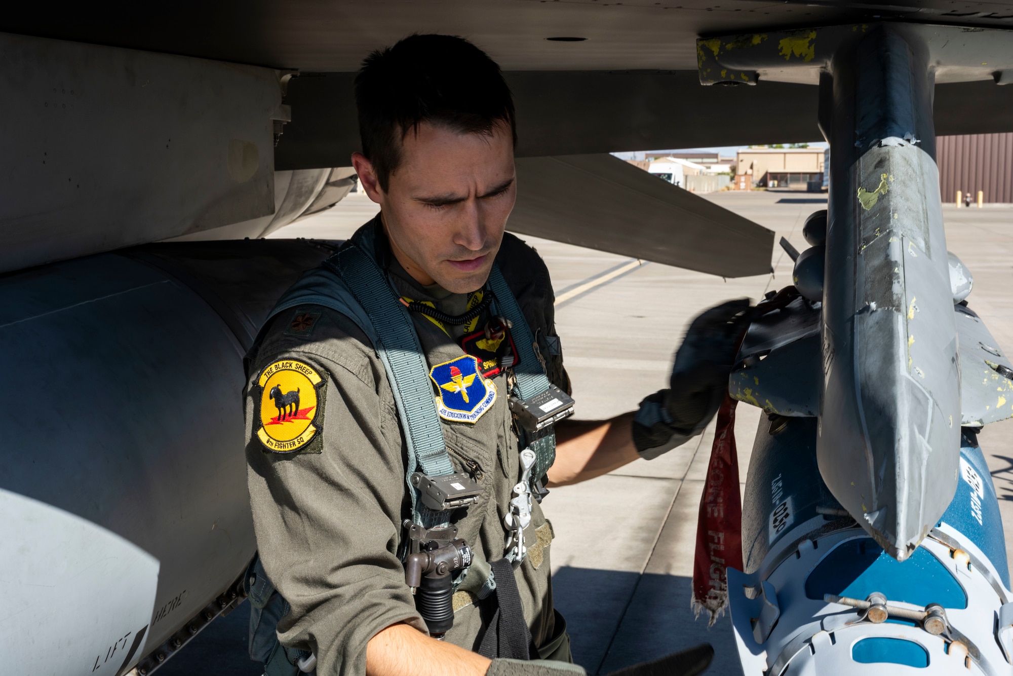 U.S. Air Force Maj. Colton Steen, 8th Fighter Squadron chief of weapons, performs a pre-flight inspection at Holloman Air Force Base, June 25, 2024. The squadron’s new flagship honors the F-117 Nighthawk, which was flown by the 8th FS for over 25 years. (U.S. Air Force photo by Airman 1st Class Michelle Ferrari)