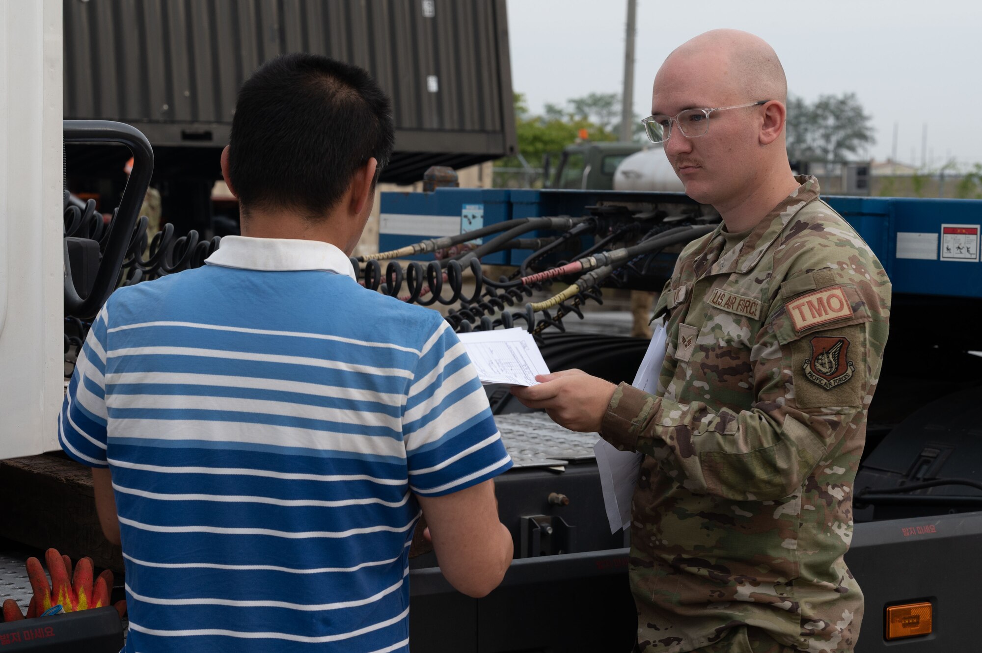 Senior Airman Johnathan Clark, 8th Logistics Readiness Squadron packing crating supervisor, prepares documentation for the transportation of intermodal containers during a munitions retrograde.