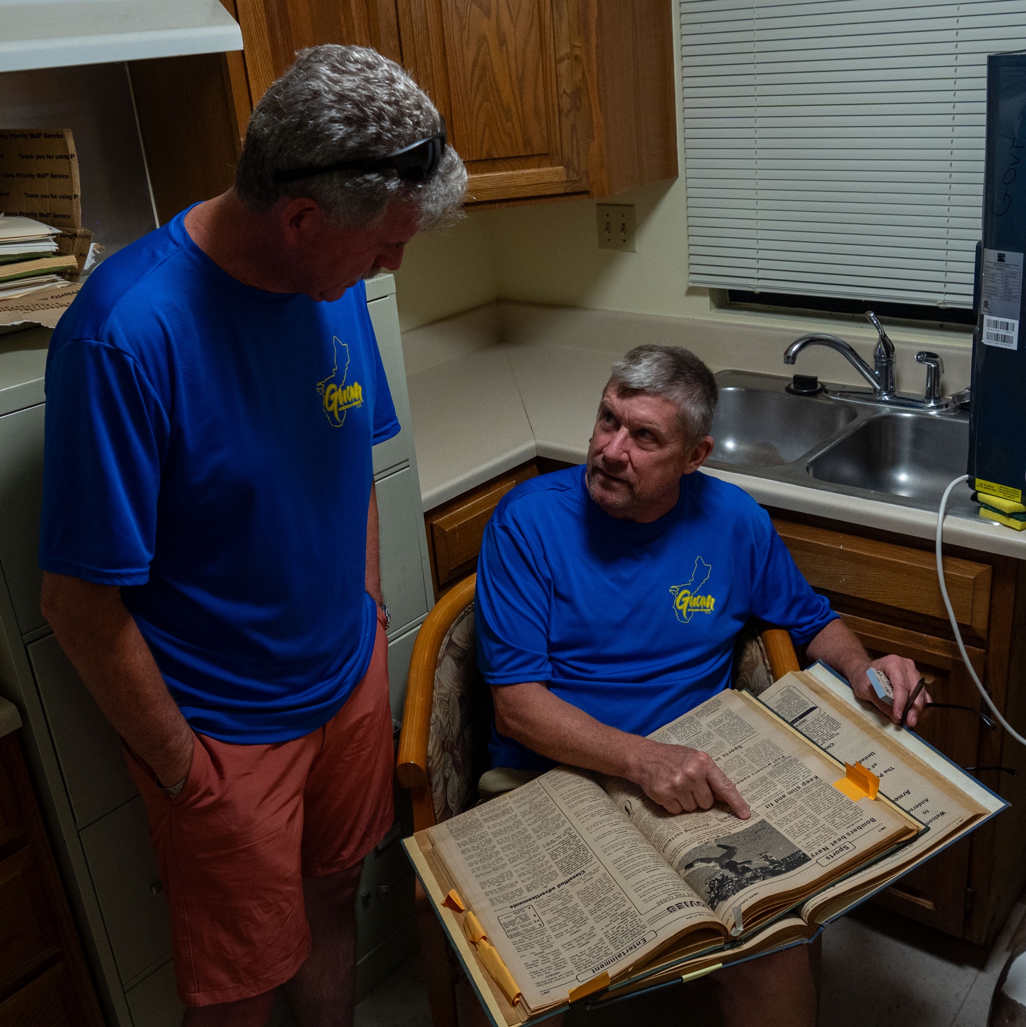 U.S. Air Force veterans return to Andersen Air Force base to look back at documents from the past. Brad Bone, Doug Marek, and Ralph Hawkins, who were stationed at Andersen Air Force Base, in the late 1970s, meet with Andersen AFB Historian Jeff Meyer.