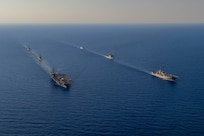 The Dwight D. Eisenhower Carrier Strike Group (IKECSG) steams in formation with the Wasp Amphibious Ready Group (WSP ARG) and the Royal Navy Daring-class air-defense destroyer HMS Duncan (D 37) in the Mediterranean Sea, June 30, 2024.