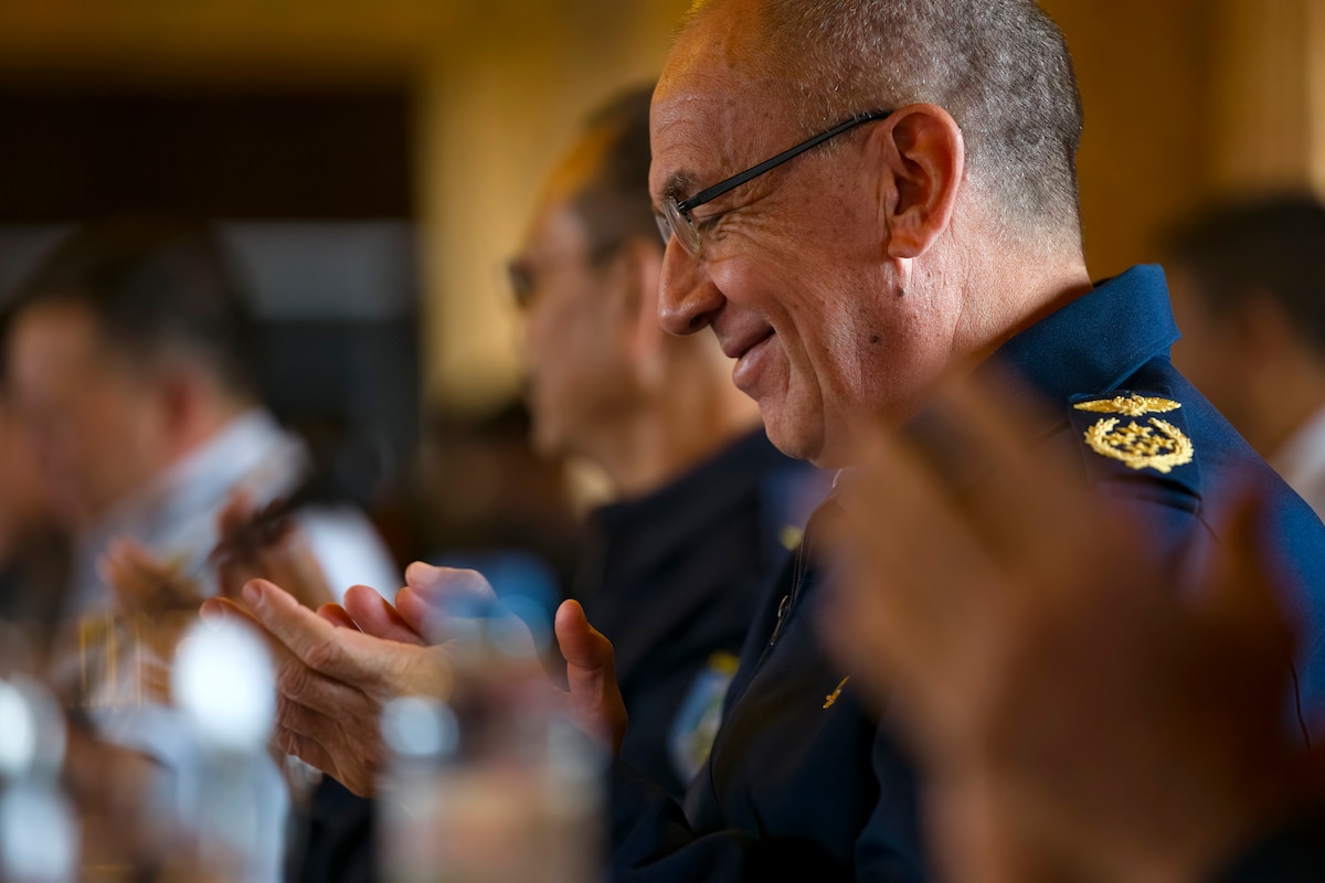 Paraguayan Air Force Commander, Gen. Julio Rubén Fullaondo Céspedes applauds during the 64th Conference of the American Air Chiefs meeting in San Carlos de Bariloche, Argentina, June 18, 2024. Much of the value gained during meetings like CONJEFAMER can be placed on the relationships built among senior leaders that helps make cooperation easier when rapid response is needed. (U.S. Air Force photo by Tech. Sgt. Rachel Maxwell)