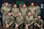 U.S. Air Force Airmen with the 7th Communications Squadron infrastructure section pose for a team photo at Dyess Air Force Base, Texas, June 26, 2024. The team was recognized for their completion of a base-wide network improvement, spanning over nine months. The team overcame the challenge of the manpower and workload involved with maintaining normal base operations while simultaneously replacing and improving network hardware. (U.S. Air Force photo by Airman 1st Class Jade M. Caldwell)