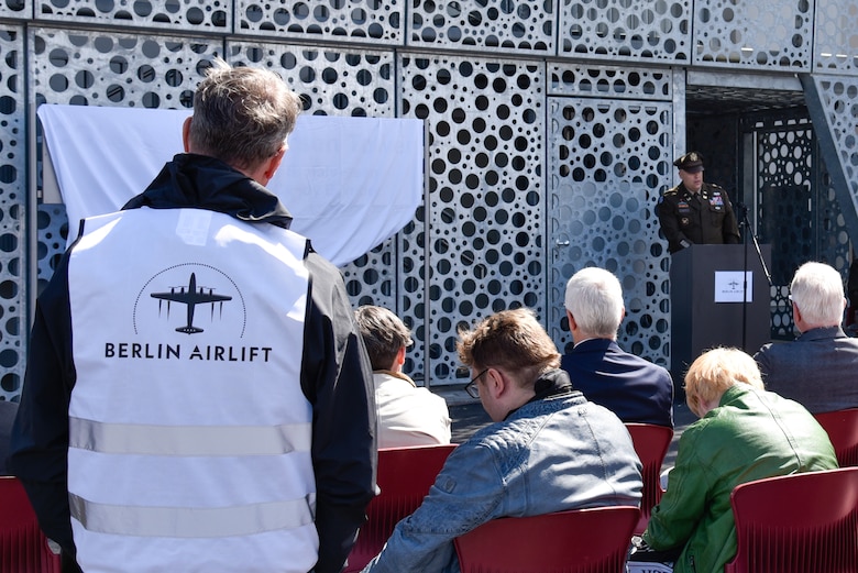 U.S. Army Corps of Engineers, Europe District Commander Col. Dan Kent speaks at a ceremony dedicating the new air traffic control tower on the Clay Kaserne portion of U.S. Army Garrison Wiesbaden the Berlin Airlift’s “Candy Bomber” – the late Col. Gail S. Halvorsen June 15, 2024. Members of the U.S. Army Garrison Wiesbaden community, U.S. Army Corps of Engineers personnel and several Berlin Airlift time witnesses and time witness family members joined together for the ceremony officially dedicating the facility as the Col. Gail S. Halvorsen Tower. (U.S. Army photo by Chris Gardner)