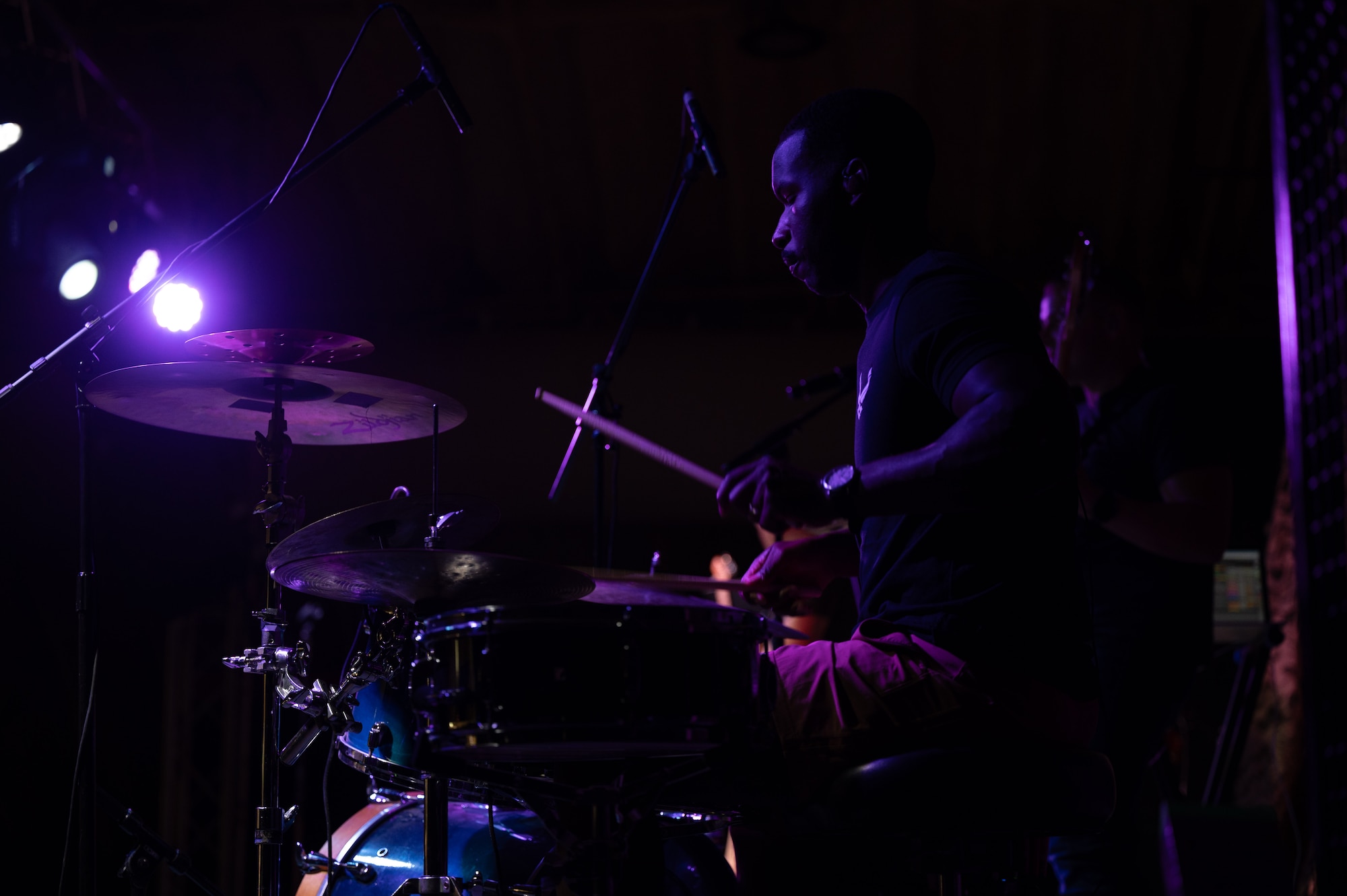 U.S. Airmen assigned to the AFCENT Band perform a concert at an undisclosed location within the U.S. Central Command area of responsibility on June 22, 2024. The AFCENT Band is a versatile group of musicians that showcase a wide variety of music ranging from Top 40, pop, rock, R&B, country, and jazz. (U.S. Air Force photo)