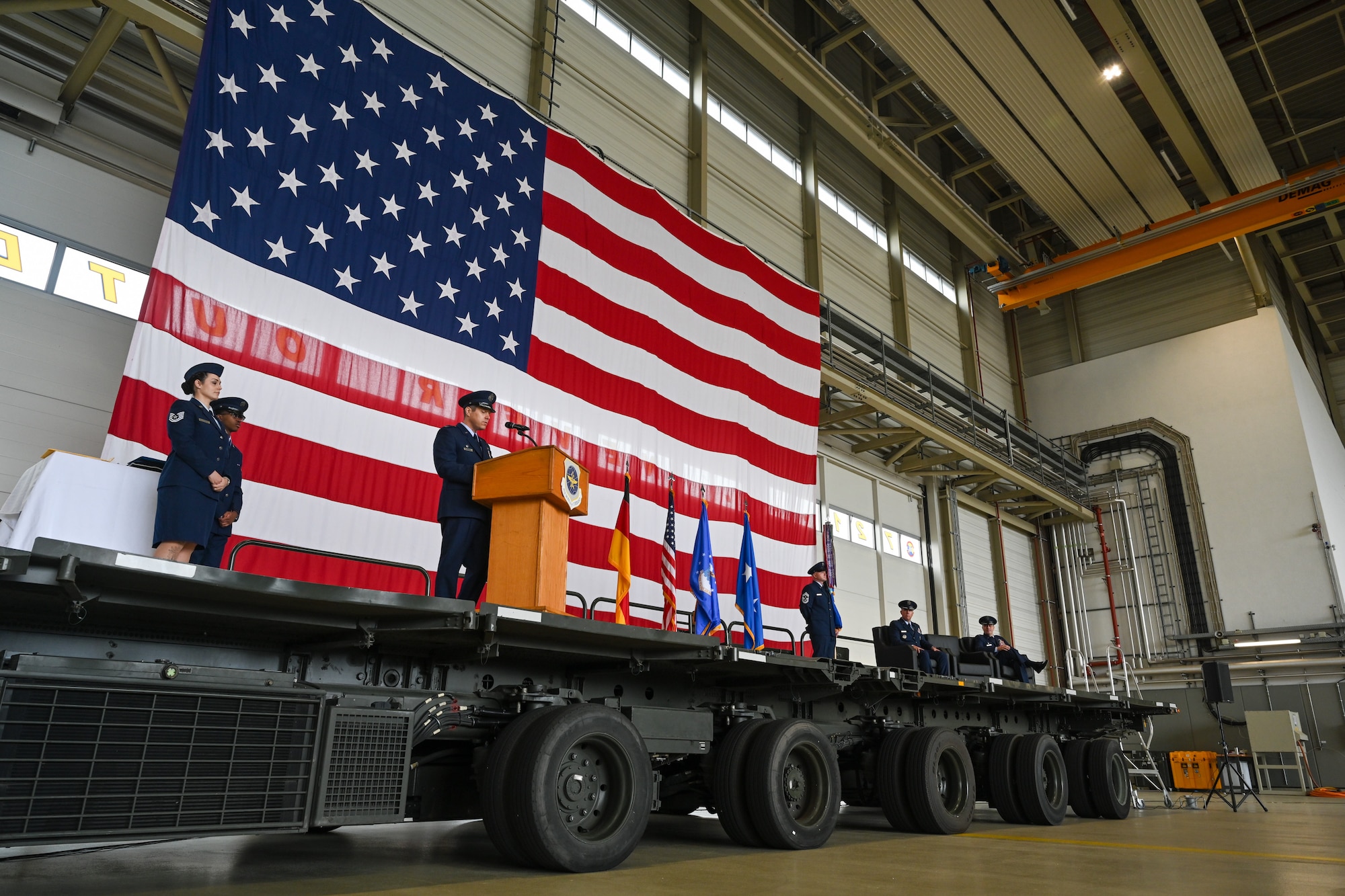 Col. Jordan Norman, incoming 521st Air Mobility Operations Wing commander, delivers remark during a change of command ceremony at Ramstein Air Base, Germany, July 3, 2024.