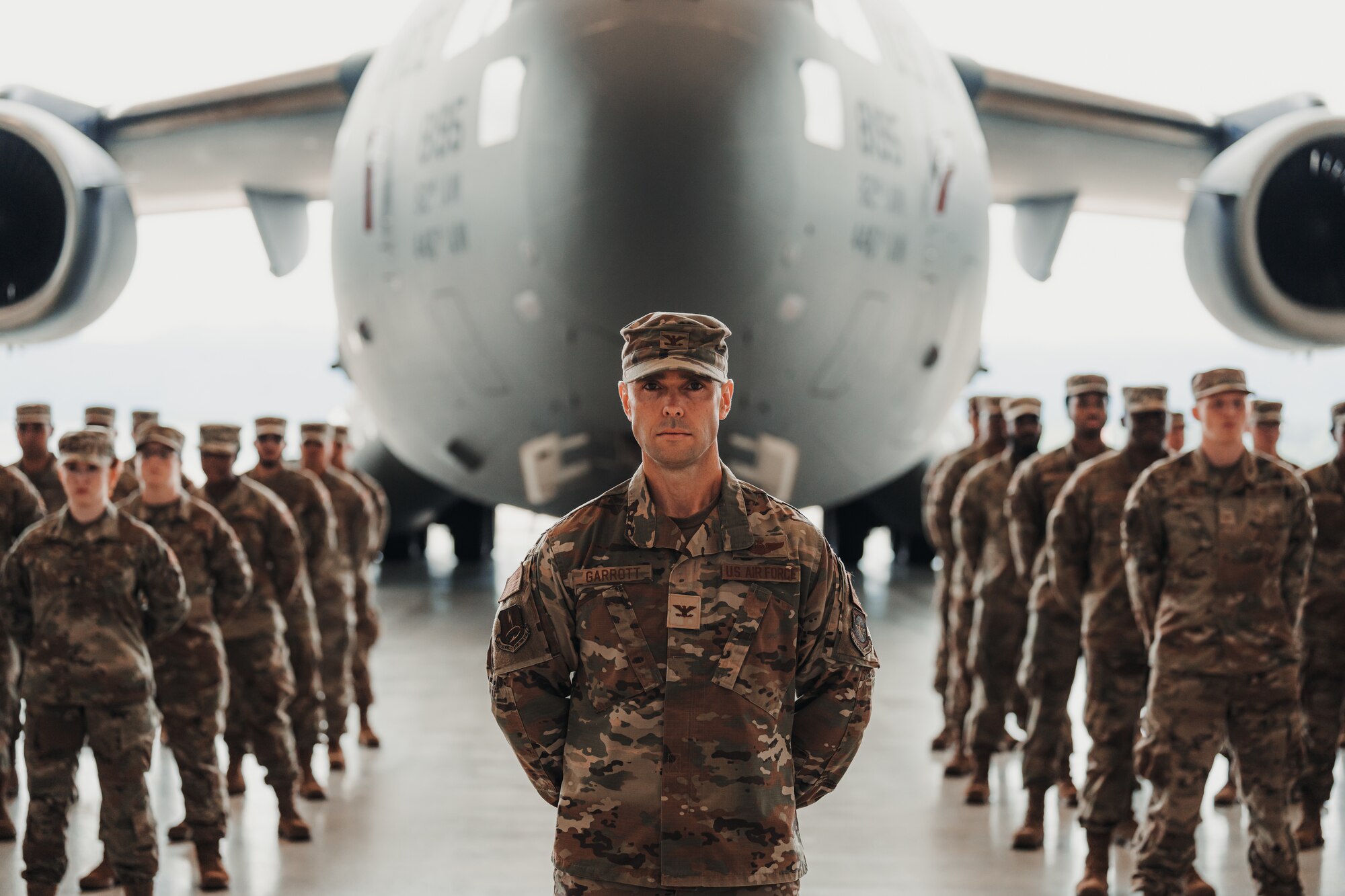 Col. Michael Garrot, 521st Air Mobility Operations Wing deputy commander, stands at parade rest while leading a formation at a change of command ceremony at Ramstein Air Base, Germany, July 3, 2024.