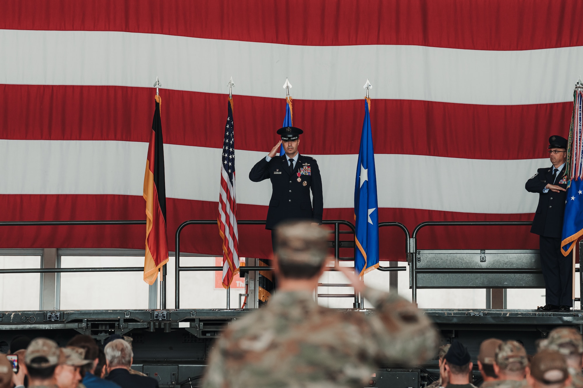 Col. Dan Cooley, outgoing 521st Air Mobility Operations Wing commander, renders his final salute during a change of command ceremony at Ramstein Air Base, Germany, July 3, 2024.