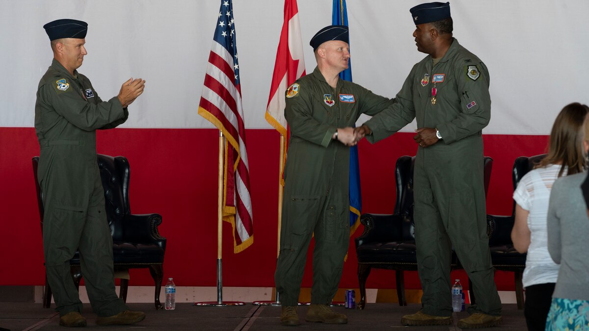 Col. James Ord 552nd, Training Group commander, thanks Col. Kendrick Carroll, former 552nd Training Group commander, during a change of command ceremony,