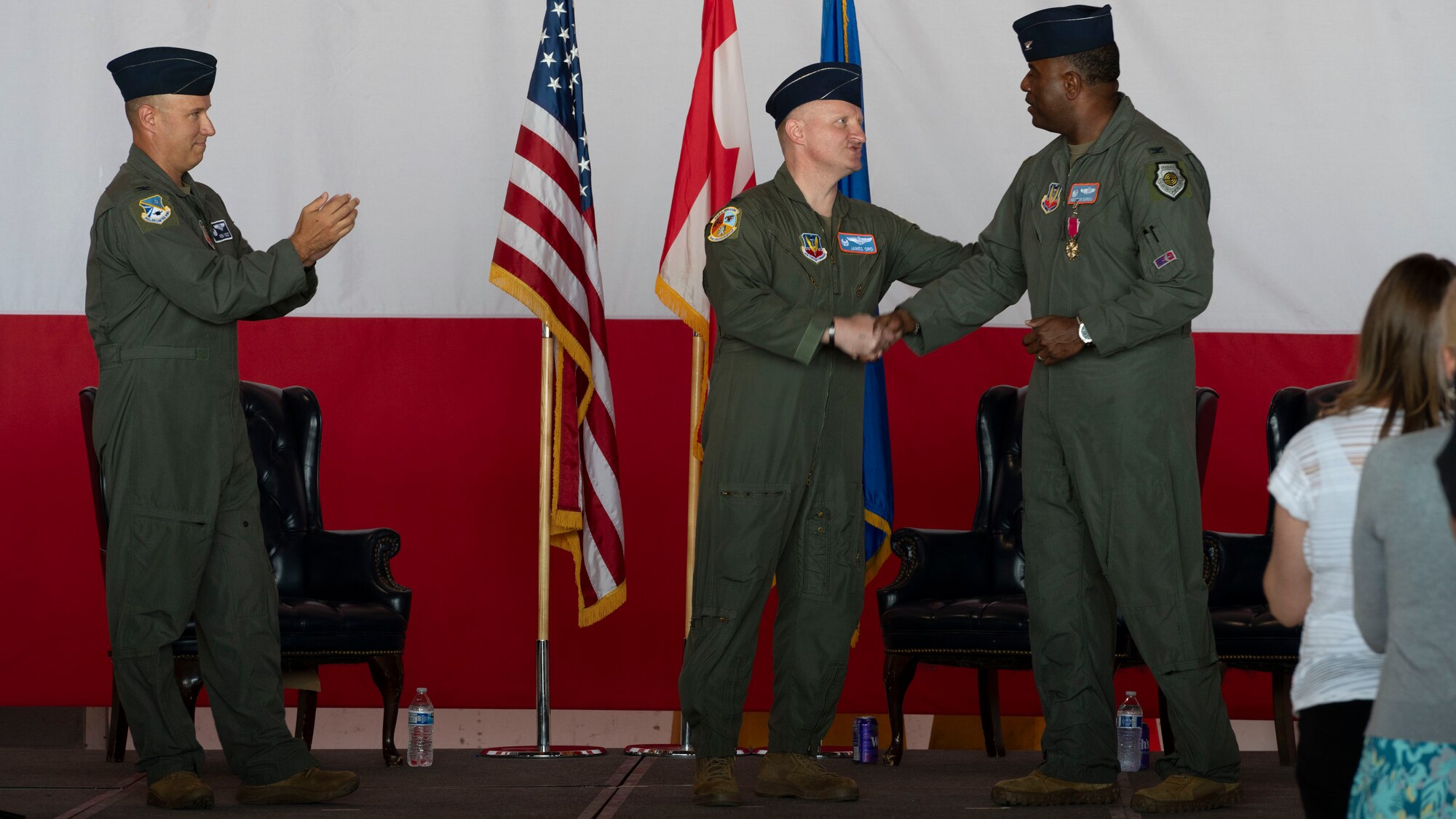Col. James Ord 552nd, Training Group commander, thanks Col. Kendrick Carroll, former 552nd Training Group commander, during a change of command ceremony,