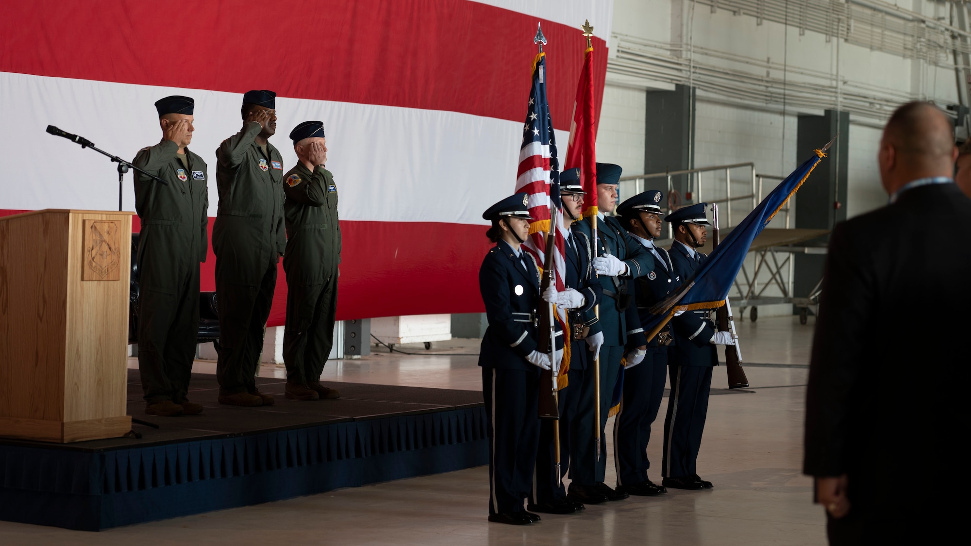 From left to right Col. Kenneth Voigt 552nd Air Control Wing commander, Col. Kendrick Carroll, former 552nd Training Group Commander and Col. James Ord 552nd, Training Group Commander, salute for the presentation of the colors during a change of command ceremony
