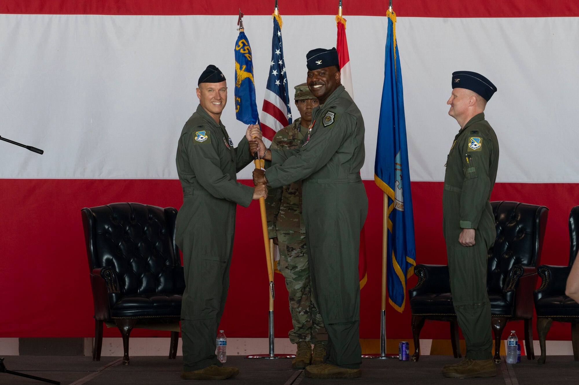 From left to right Col. Kenneth Voigt 552nd Air Control Wing commander, Col. Kendrick Carroll, former 552nd Training Group Commander and Col. James Ord 552nd, Training Group Commander, salute for the presentation of the colors during a change of command ceremony