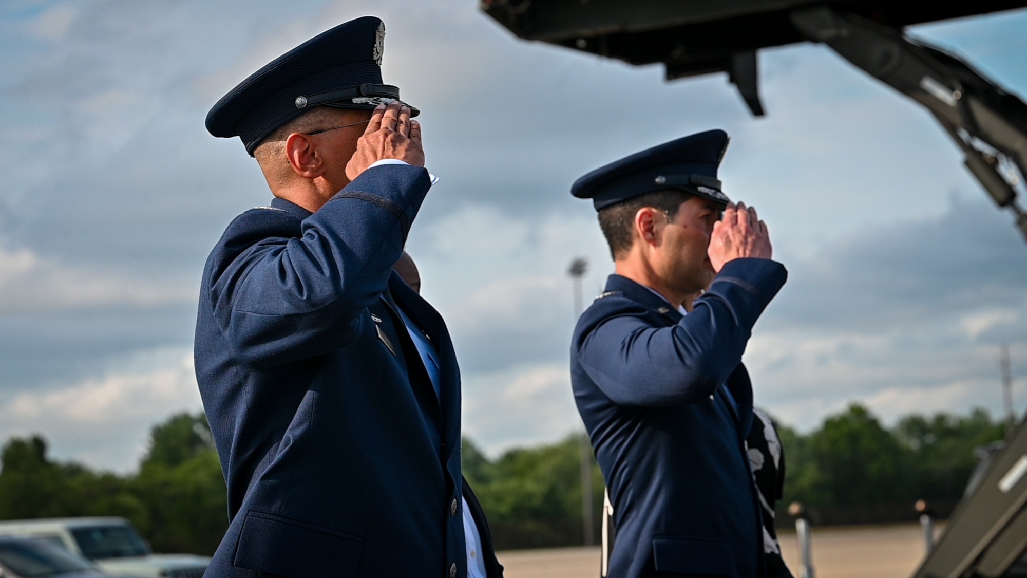 U.S. Air Force Col. Anthony Smith, Joint Base McGuire-Dix-Lakehurst commander and 87th Air Base Wing commander, and Col. William Soto, 305th Air Mobility Wing deputy commander, render a salute for U.S. President Joe Biden at JB MDL, N.J., June 29, 2024. The president and his family then boarded Marine Corps One enroute to Red Bank, N.J. (U.S. Air Force photo by 2nd Lt. Alexis Kula)
