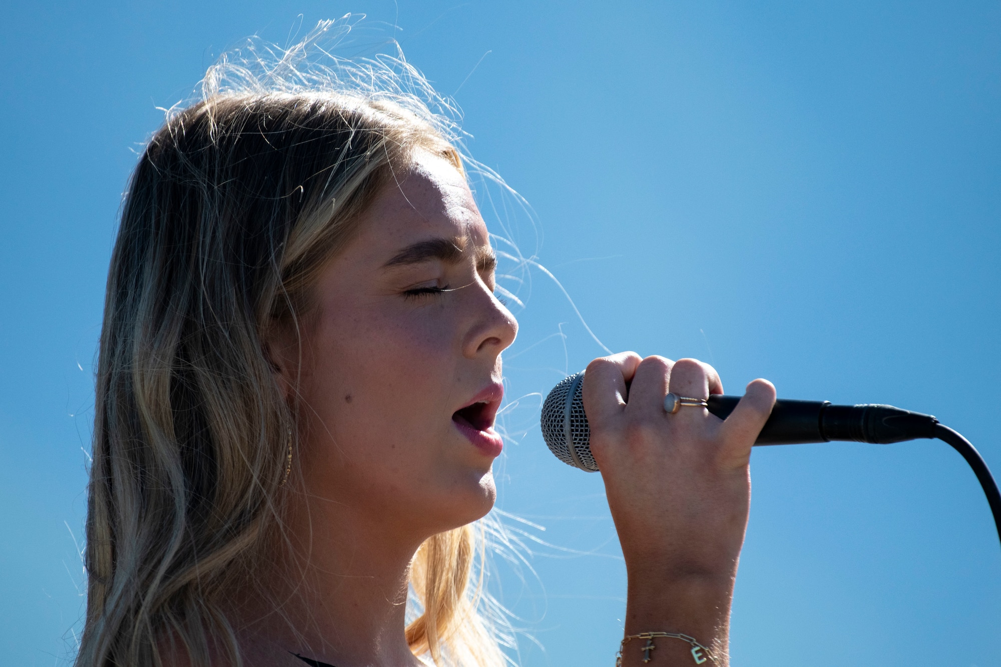 Francom singing into a microphone.