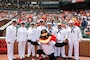 Sailors from USS Marinette (LCS-25) and Navy Band Sea Chanters Chorus pose for a photo before a Baltimore Orioles game during Fleet Week Maryland.  This year marks the City of Baltimore's fourth time hosting Navy Fleet Week. Maryland Fleet Week and Flyover Baltimore provides an opportunity for the citizens of Maryland and the City of Baltimore to meet Sailors, Marines, and Coast Guardsmen, as well as see firsthand the latest capabilities of today’s maritime services. More than 2,300 sea service members are expected to participate this year. (U.S. Navy Photo by Mass Communication Specialist 1st Class Thomas Higgins/Released)