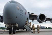 Military personal board an aircraft