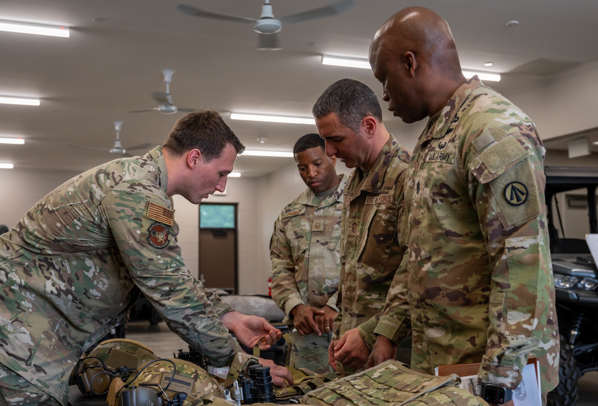 Military personal inspect military equipment