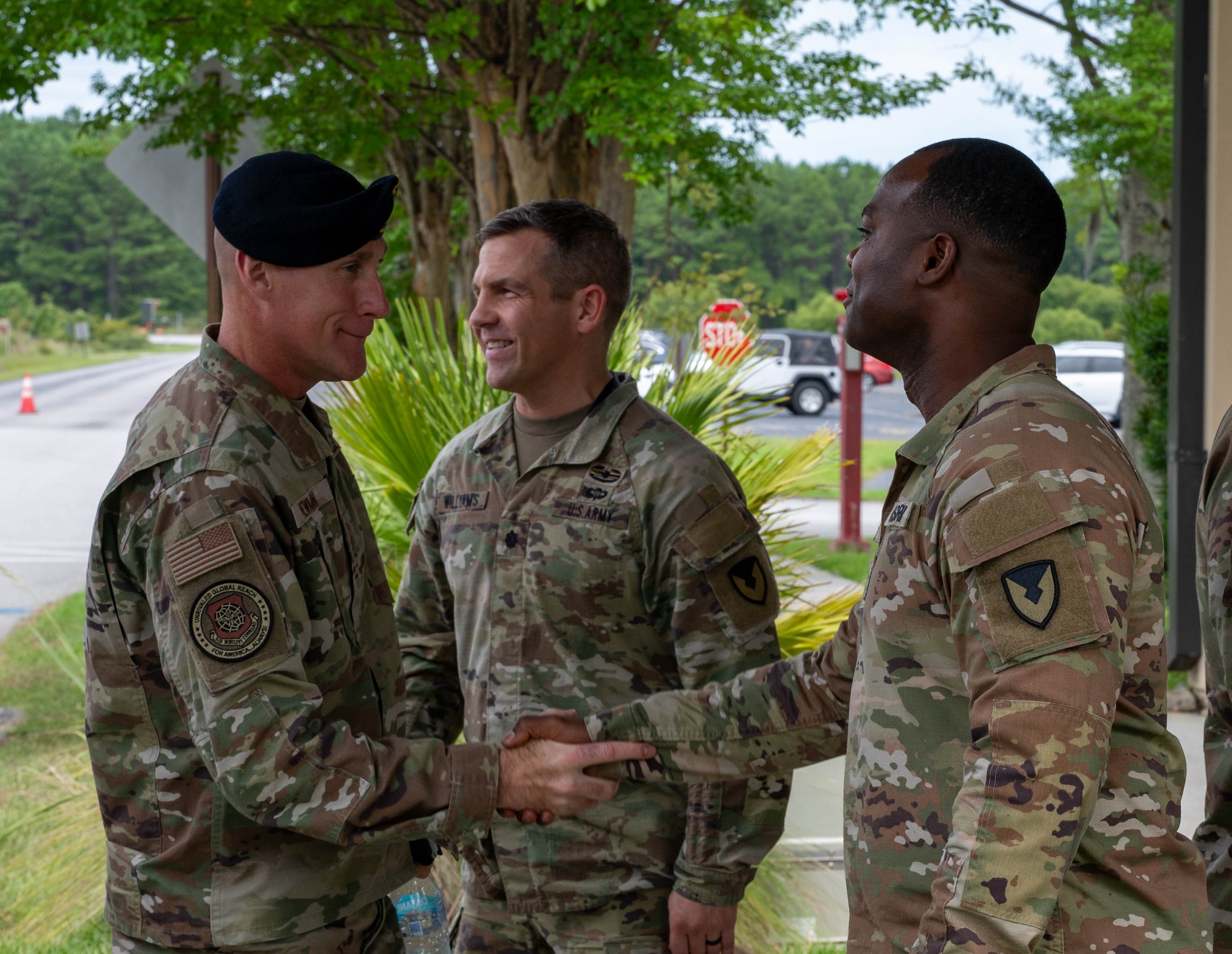 Military personal shake hands