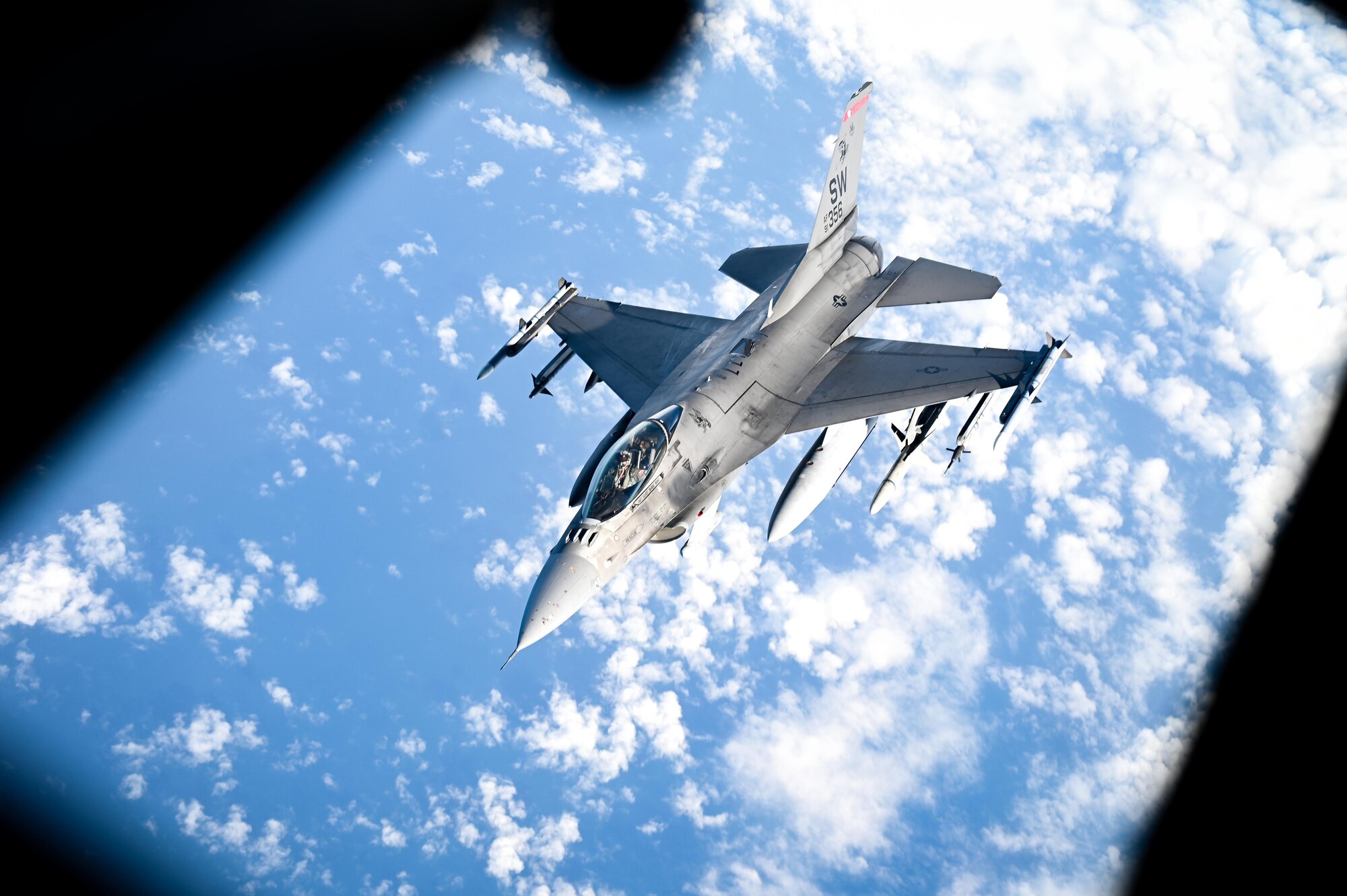 An F-16 performs an aerial refueling.