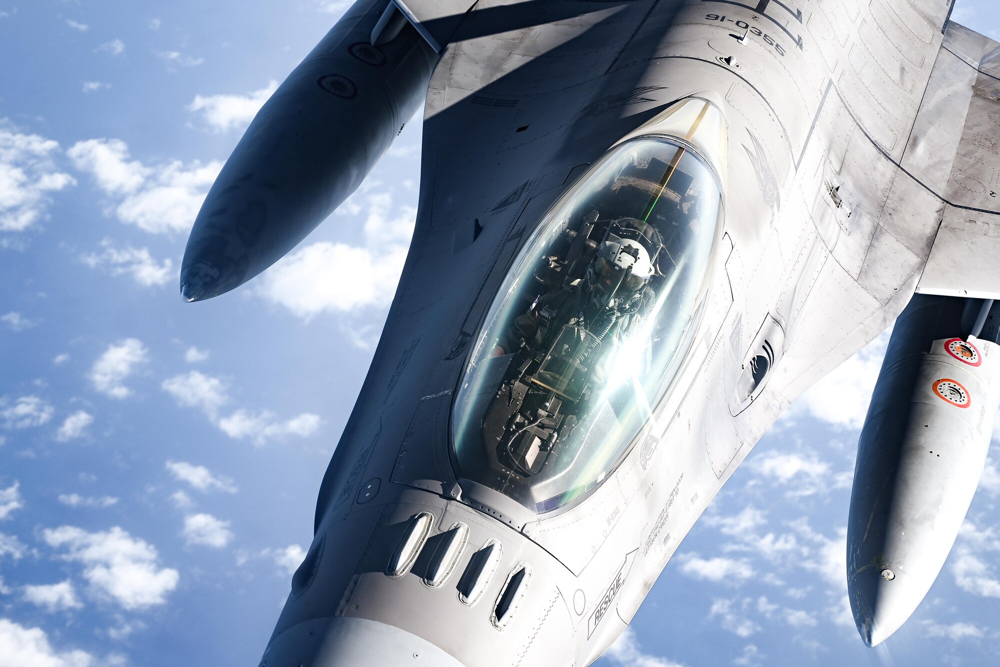 A pilot performs an aerial refueling.