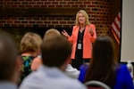 Acquisition executive speaks to audience