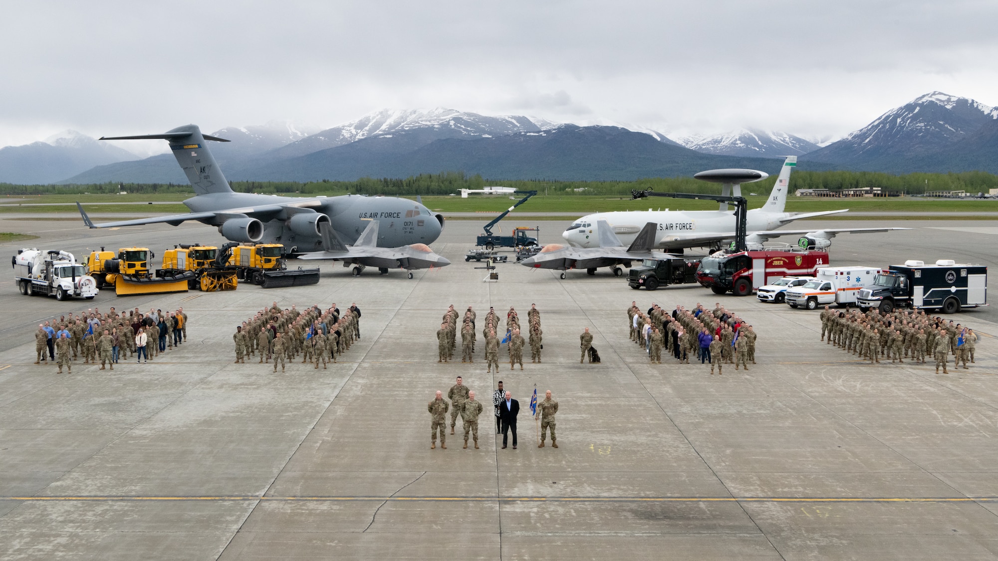 Members of the 673d Air Base Wing stand on the flight line at Joint Base Elmendorf-Richardson, Alaska, June 2, 2023. The 673d ABW comprises of over 5,500 joint military and civilian personnel, supporting and enabling America’s Arctic Warriors and their families. (U.S. Air Force photo by Senior Airman Patrick Sullivan)
