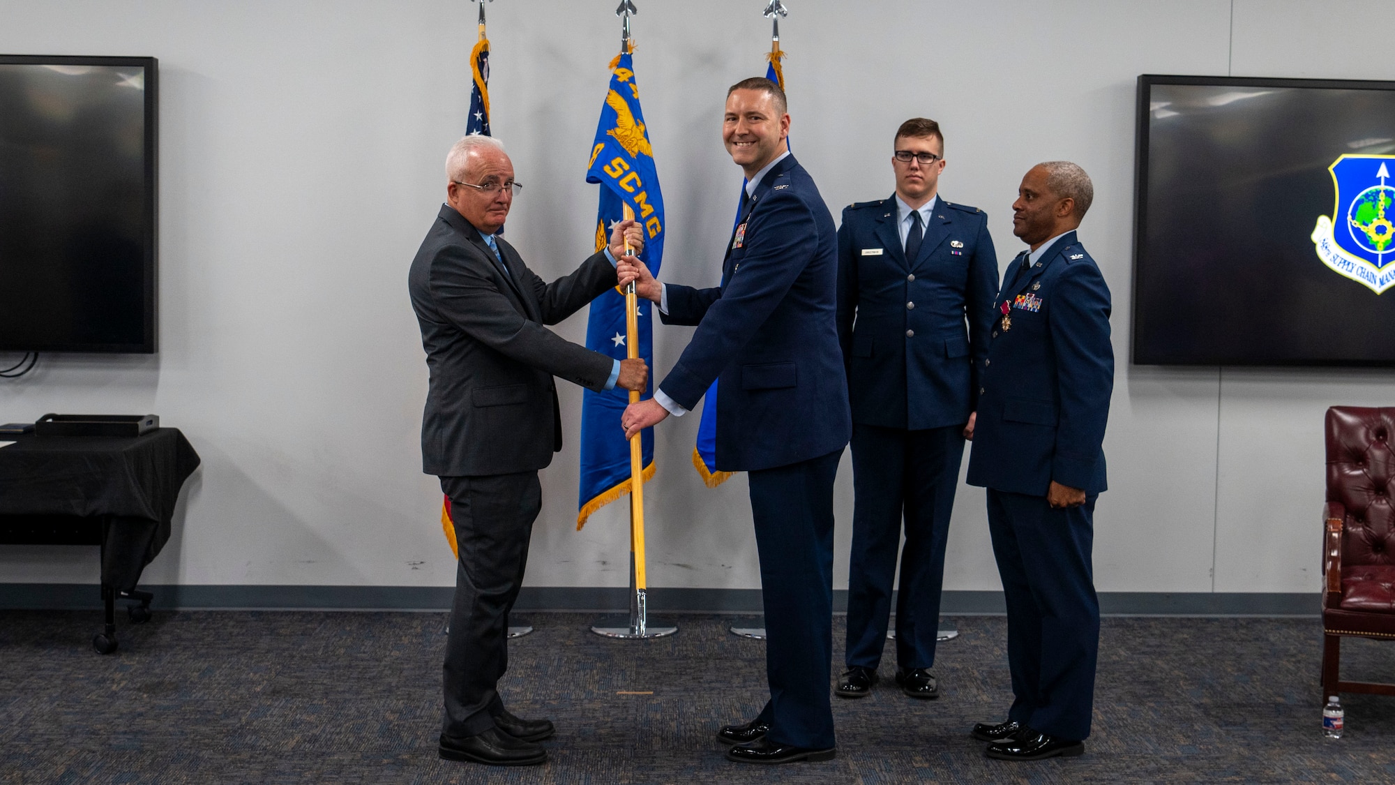 Col. Mol accepts guidon from presiding officer