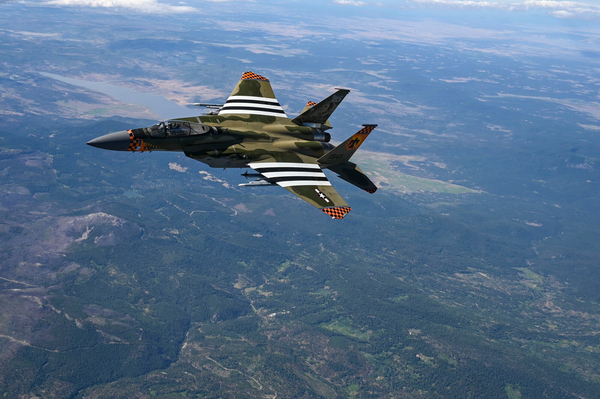 An F-15C Eagle flies in the sky.