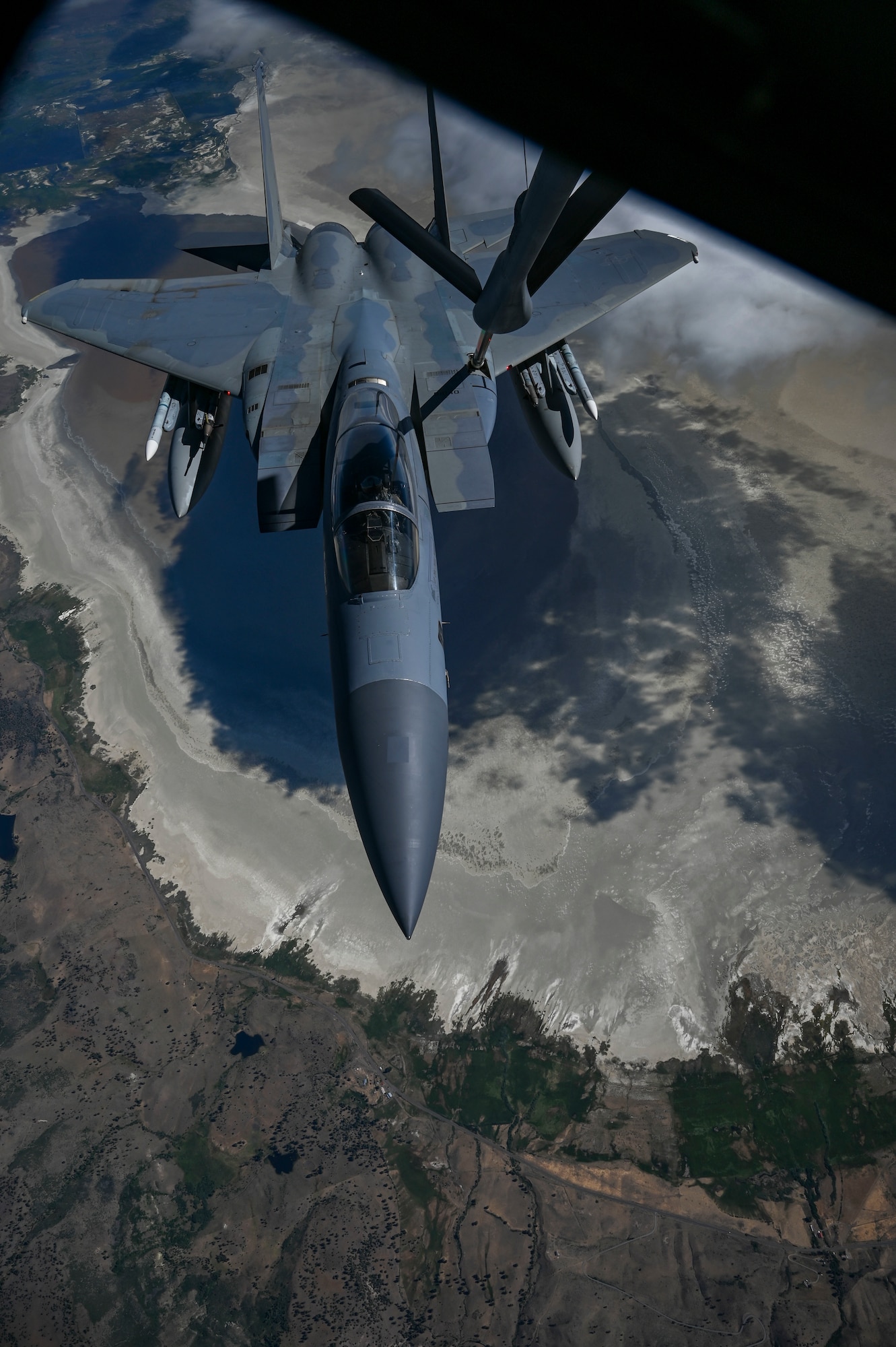 An F-15C Eagle is being refueled by a KC-135 Stratotanker.