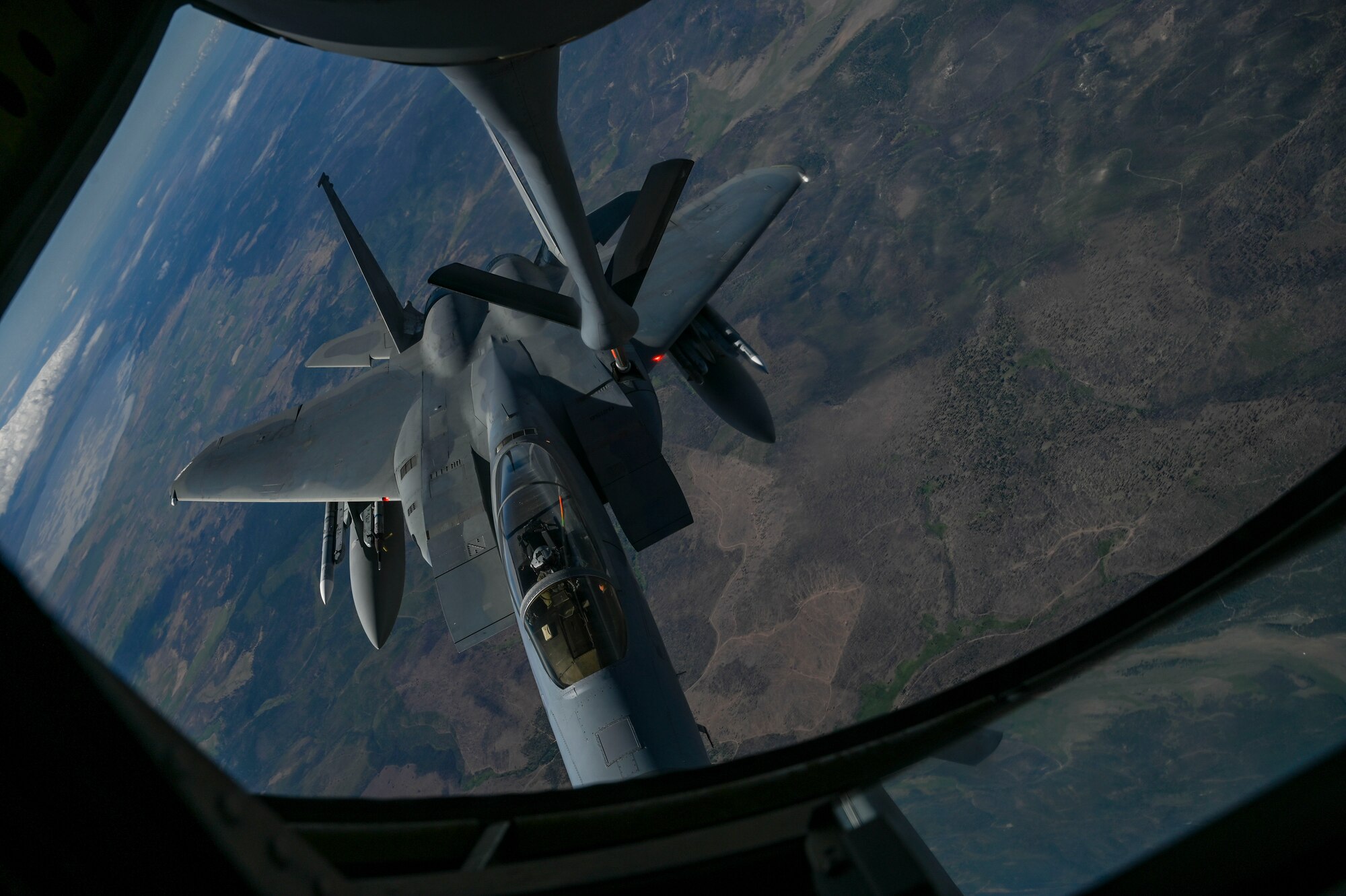 An F-15C Eagle is being refueled by a KC-135 Stratotanker.