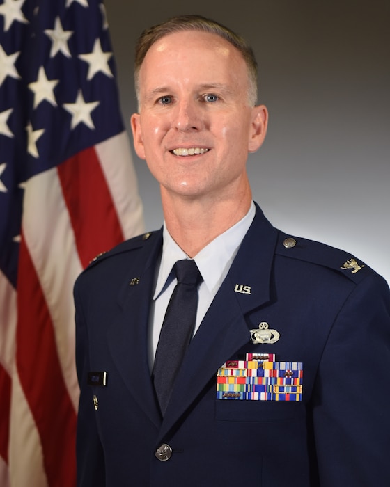 Photo of a male Air Force officer wearing blue service dress uniform.